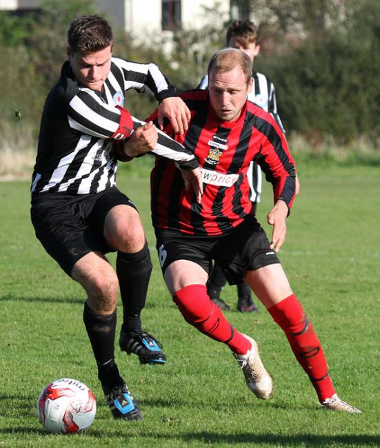 Tenbys Jack Christopher and Neylands Henry Durrant tussle for the ball